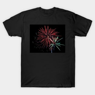 Fireworks explode in dark sky T-Shirt